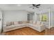 Spacious living room featuring hardwood floors and a large sectional sofa at 204 Holly Creek Way, Woodstock, GA 30188