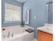 Bright bathroom with a soaking tub, and neutral tones at 2264 Howell Farms Nw Trl, Acworth, GA 30101