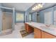 Well-lit bathroom with double vanity, soaking tub, a separate shower, and blue walls at 2264 Howell Farms Nw Trl, Acworth, GA 30101