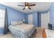 Comfortable bedroom with natural light, a ceiling fan, and neutral tones at 2264 Howell Farms Nw Trl, Acworth, GA 30101
