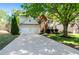 Inviting two-story home with a two-car garage, well-maintained lawn and mature trees shading the property at 2264 Howell Farms Nw Trl, Acworth, GA 30101