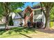 Beautifully landscaped front yard with mature trees, colorful flowers, and healthy shrubbery creating curb appeal at 2264 Howell Farms Nw Trl, Acworth, GA 30101