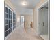 Bright hallway with neutral tones, carpeted floor, and white trim doors allowing natural light at 2264 Howell Farms Nw Trl, Acworth, GA 30101