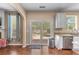 Bright kitchen with backyard views through sliding glass doors, stainless steel appliances, and granite countertops at 2264 Howell Farms Nw Trl, Acworth, GA 30101