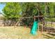 Backyard playground with slide, swings, and climbing structure for outdoor fun at 2264 Howell Farms Nw Trl, Acworth, GA 30101