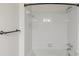 A well-maintained tub and shower with white tile and bronze hardware at 2308 Country Park Se Dr, Smyrna, GA 30080