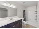 Modern bathroom featuring a vanity with dark wood cabinets and a shower-tub combination for relaxation at 2308 Country Park Se Dr, Smyrna, GA 30080