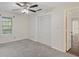 Comfortable bedroom with neutral carpet, natural light, and ample closet space for storage at 2308 Country Park Se Dr, Smyrna, GA 30080