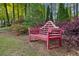 Landscaped garden area with a decorative pink wooden bench, perfect for relaxing at 2308 Country Park Se Dr, Smyrna, GA 30080
