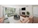 Bright living room with a large window, fireplace, and modern furnishings for comfortable living at 2308 Country Park Se Dr, Smyrna, GA 30080