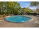 Sparkling community swimming pool surrounded by lounge chairs and lush greenery at 2308 Country Park Se Dr, Smyrna, GA 30080