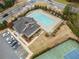 Birds eye view of the community pool, tennis courts, clubhouse, and lush landscaping at 441 Spring View Dr, Woodstock, GA 30188