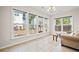 Bright dining area with large windows offering natural light and outdoor views at 441 Spring View Dr, Woodstock, GA 30188