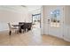 Inviting dining room featuring a stylish light fixture, wainscoting, and natural light at 441 Spring View Dr, Woodstock, GA 30188