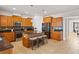 Modern kitchen with wooden cabinets, island with barstools, and stainless-steel appliances at 441 Spring View Dr, Woodstock, GA 30188
