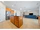 Modern kitchen featuring a large island, stainless steel appliances, and open living space at 441 Spring View Dr, Woodstock, GA 30188