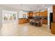 Open kitchen features wood cabinets, granite countertops, stainless appliances, and a center island with barstool seating at 441 Spring View Dr, Woodstock, GA 30188