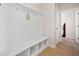 Mudroom with built-in bench, storage cubbies, and tile flooring at 441 Spring View Dr, Woodstock, GA 30188