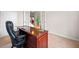 Office space with a wooden desk, chair, and French doors at 441 Spring View Dr, Woodstock, GA 30188