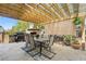 Outdoor patio with stone fireplace, built in grill, and dining furniture at 441 Spring View Dr, Woodstock, GA 30188