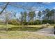 Waterside view of a pond with bridge, lush greenery, and serene atmosphere at 441 Spring View Dr, Woodstock, GA 30188