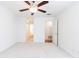 Neutral bedroom featuring a ceiling fan, closets, and bathroom access at 1634 Ponce De Leon Ne Ave # 506, Atlanta, GA 30307