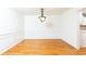 Traditional dining room with hardwood floors, chair rail, crown molding, and decorative light fixture at 1634 Ponce De Leon Ne Ave # 506, Atlanta, GA 30307