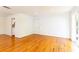 Bright living room with hardwood floors, white walls, and access to the kitchen and sliding glass door at 1634 Ponce De Leon Ne Ave # 506, Atlanta, GA 30307