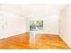 Large living room featuring hardwood floors and sliding doors leading to outdoor space at 1634 Ponce De Leon Ne Ave # 506, Atlanta, GA 30307
