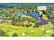Expansive aerial view of a luxury community with a golf course and lake at 2644 Nutwood Trce, Duluth, GA 30097