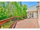Second story deck with lush surroundings and wrought iron railings at 2644 Nutwood Trce, Duluth, GA 30097