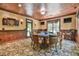 Bright game room offers a dart board, poker table, and comfortable seating for entertaining guests at 2644 Nutwood Trce, Duluth, GA 30097