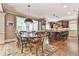 Bright kitchen and dining area featuring a breakfast bar and hardwood floors at 2644 Nutwood Trce, Duluth, GA 30097