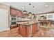 Beautiful kitchen showcasing a large island, stainless steel appliances, and hardwood floors at 2644 Nutwood Trce, Duluth, GA 30097