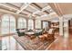 Spacious living room featuring coffered ceilings and large arched windows at 2644 Nutwood Trce, Duluth, GA 30097