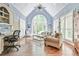 Bright living room with vaulted ceiling, plantation shutters and hardwood floors at 2644 Nutwood Trce, Duluth, GA 30097
