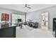 Bright office with multiple computer workstations, a ceiling fan, and an attached bathroom at 2644 Nutwood Trce, Duluth, GA 30097