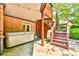 Inviting outdoor patio with hot tub, unique wood stairs, and string lights perfect for relaxation at 2644 Nutwood Trce, Duluth, GA 30097