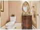Charming powder room with an ornate vanity and stylish fixtures at 2644 Nutwood Trce, Duluth, GA 30097