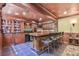An elegant wet bar area includes display shelving and bar seating at 2644 Nutwood Trce, Duluth, GA 30097
