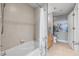 Bathroom featuring tile floors, shower and tub combination, and framed art at 3338 Peachtree Ne Rd # 1010, Atlanta, GA 30326