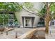 Modern building entrance with unique architecture, landscaping and accessible ramp at 3338 Peachtree Ne Rd # 1010, Atlanta, GA 30326
