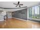 Spacious living room featuring hardwood floors, modern light fixtures, and city views at 3338 Peachtree Ne Rd # 1010, Atlanta, GA 30326