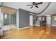 Spacious living room with hardwood floors, open layout, balcony and a ceiling fan at 3338 Peachtree Ne Rd # 1010, Atlanta, GA 30326