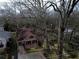 An aerial shot of this in-town bungalow home with a brick exterior nestled among mature trees at 698 Bellemeade Nw Ave, Atlanta, GA 30318