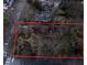 Aerial view of a property, partially obscured by trees, with red boundary lines at 698 Bellemeade Nw Ave, Atlanta, GA 30318