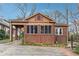 Charming brick home with a screened-in porch and a covered driveway at 698 Bellemeade Nw Ave, Atlanta, GA 30318