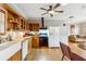 Bright kitchen with wood cabinets, white appliances, and hardwood floors at 698 Bellemeade Nw Ave, Atlanta, GA 30318