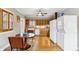 Open-concept kitchen featuring wooden cabinetry, modern appliances and breakfast area at 698 Bellemeade Nw Ave, Atlanta, GA 30318