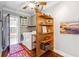 Bright laundry room featuring shelving, laundry machines and doorway leading to bathroom at 698 Bellemeade Nw Ave, Atlanta, GA 30318